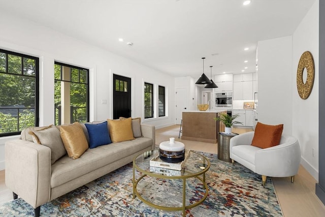 145 Warren St Unit 5, Newton, MA 02459 - living room with recessed lighting and light wood finished floors