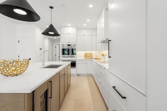 145 Warren St Unit 5, Newton, MA 02459 - kitchen featuring modern cabinets, wine cooler, recessed lighting, white cabinets, and double oven
