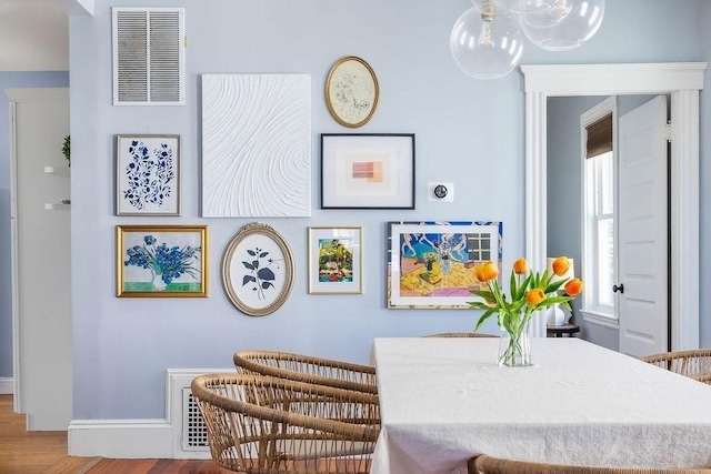 41 Sudan St Unit 3, Boston, MA 02125 - dining room with wood finished floors and a chandelier