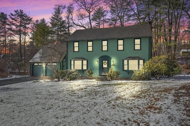 colonial inspired home featuring a garage