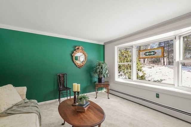 living area with crown molding, carpet floors, and a baseboard heating unit