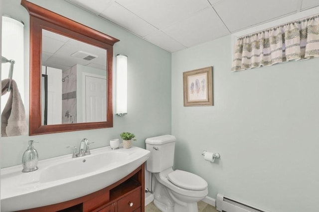 bathroom with vanity, a baseboard heating unit, and toilet