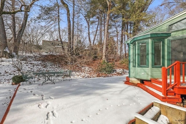 view of yard layered in snow