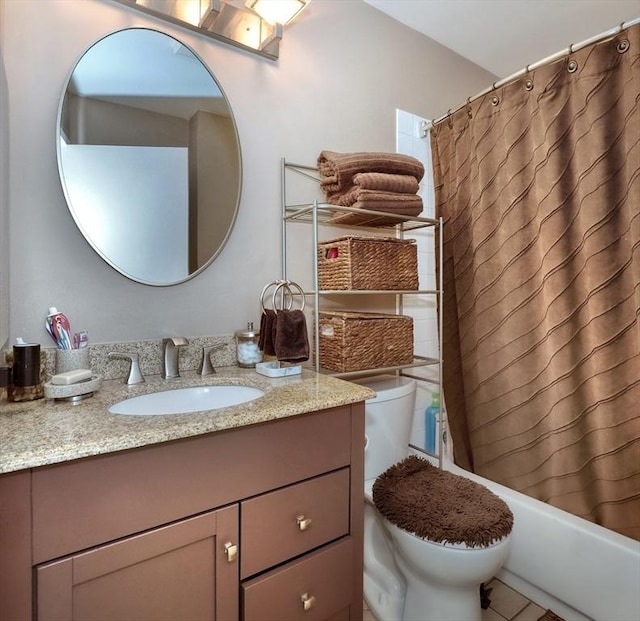 full bathroom featuring toilet, shower / bath combo, and vanity