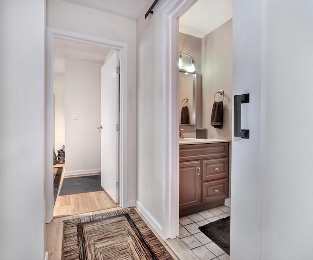 bathroom with vanity and tile patterned flooring