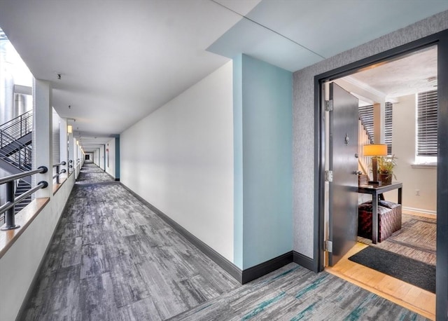 corridor featuring wood-type flooring