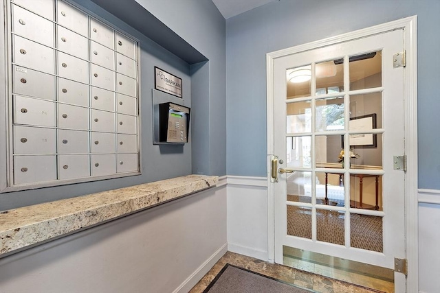 60 Glen Rd Unit 107, Brookline, MA 02445 - doorway with baseboards and mail area