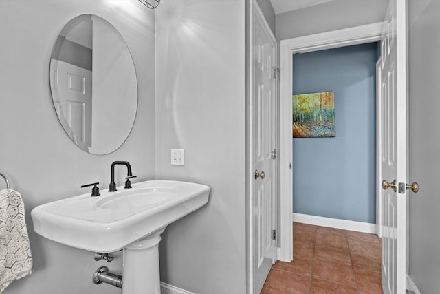 bathroom featuring tile patterned floors and baseboards