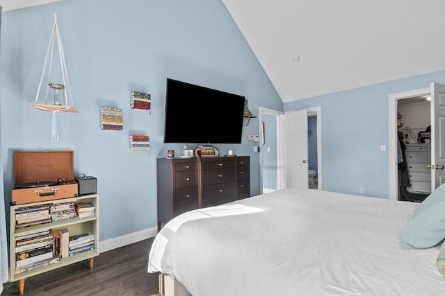 bedroom featuring dark wood-style floors, baseboards, and high vaulted ceiling