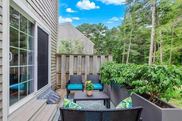 300 Falmouth Rd Unit 12A, Mashpee, MA 02649 - view of wooden balcony with a deck and an outdoor living space