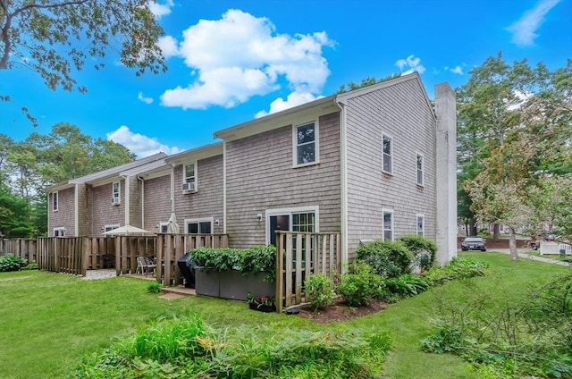 300 Falmouth Rd Unit 12A, Mashpee, MA 02649 - back of property with a chimney