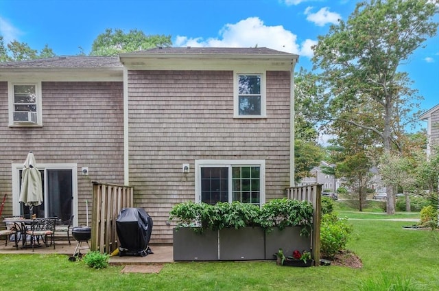300 Falmouth Rd Unit 12A, Mashpee, MA 02649 - back of property with a lawn and a patio area