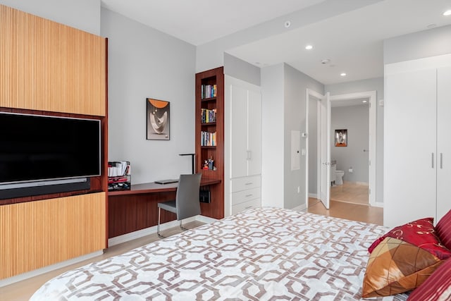 bedroom featuring built in desk