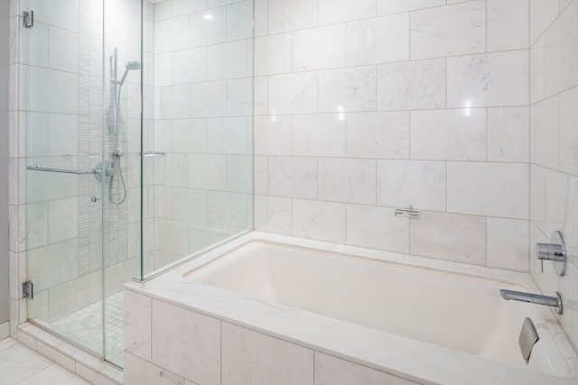 bathroom with shower with separate bathtub