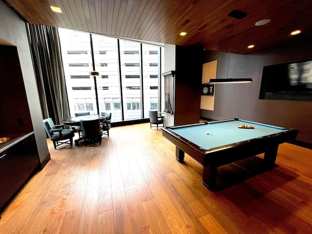 rec room featuring a wall of windows, light hardwood / wood-style floors, pool table, and wooden ceiling