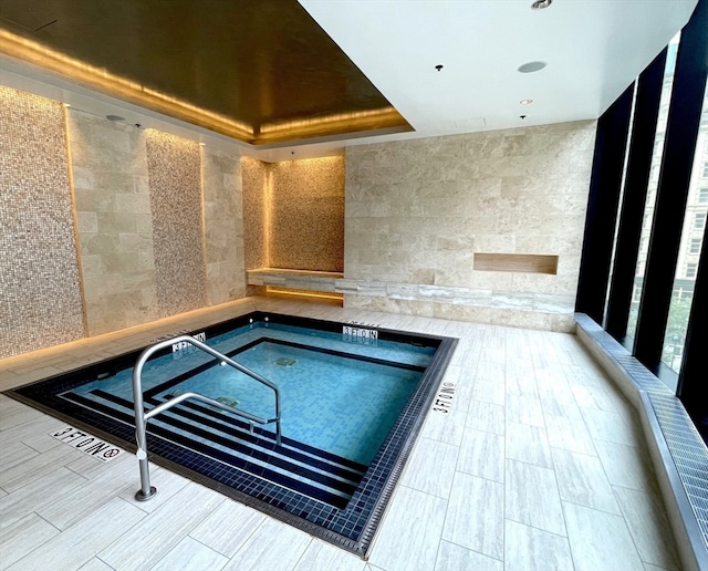 view of pool featuring an indoor hot tub