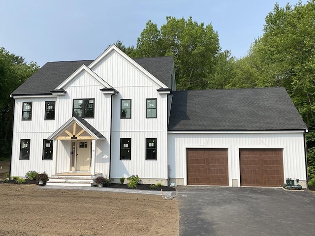 40 Old Summit St, Halifax, MA 02338 - modern farmhouse style home with roof with shingles, a garage, asphalt driveway, and board and batten siding