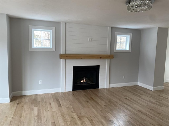 40 Old Summit St, Halifax, MA 02338 - unfurnished living room with wood finished floors, a large fireplace, and baseboards