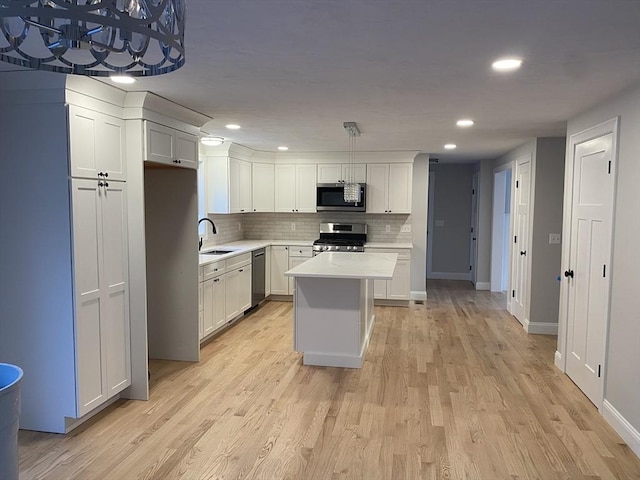 40 Old Summit St, Halifax, MA 02338 - kitchen featuring appliances with stainless steel finishes, light countertops, a sink, backsplash, and recessed lighting
