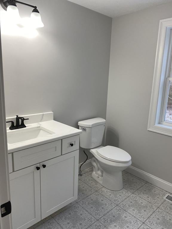 40 Old Summit St, Halifax, MA 02338 - half bath featuring vanity, toilet, and baseboards