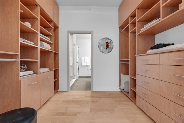 spacious closet featuring light wood-style flooring