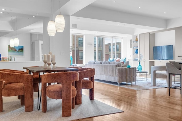 dining area featuring light wood-type flooring and recessed lighting