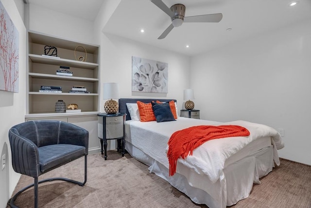 carpeted bedroom with a ceiling fan and recessed lighting