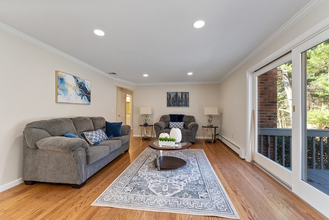 living room with a baseboard radiator, light hardwood / wood-style floors, and crown molding