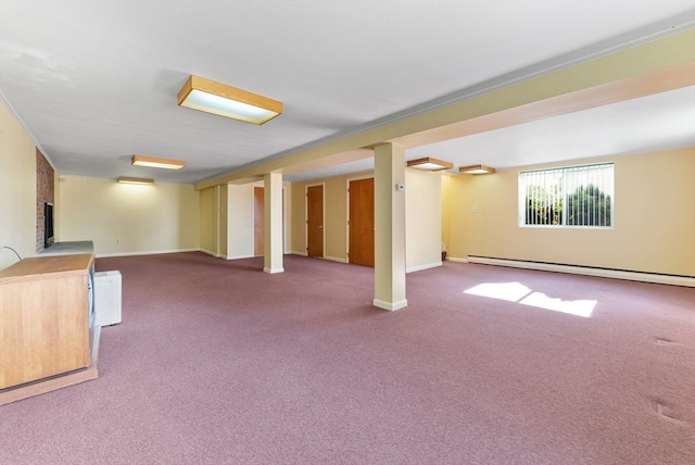 basement with a brick fireplace, a baseboard radiator, and carpet