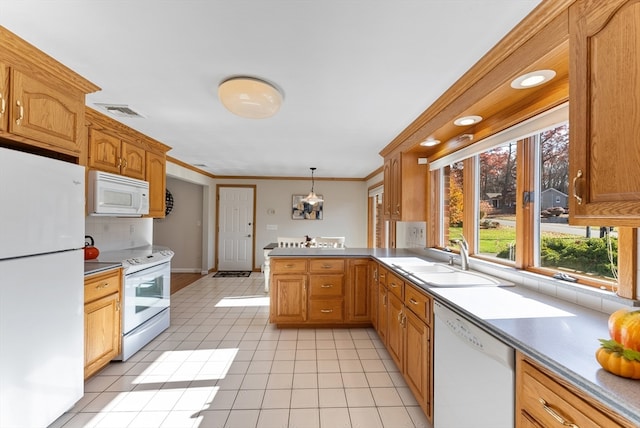 kitchen with sink, ornamental molding, light tile patterned flooring, white appliances, and decorative light fixtures