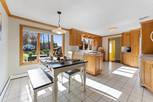 dining room with baseboard heating, light tile patterned floors, and ornamental molding