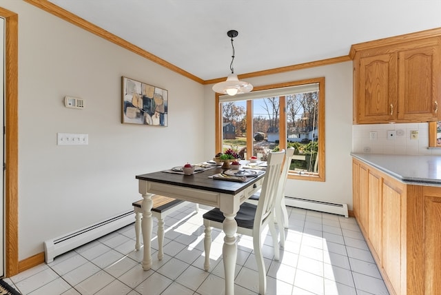 tiled dining area featuring baseboard heating and ornamental molding