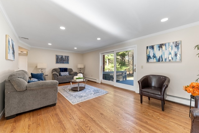 living room with a baseboard heating unit, light hardwood / wood-style floors, and ornamental molding