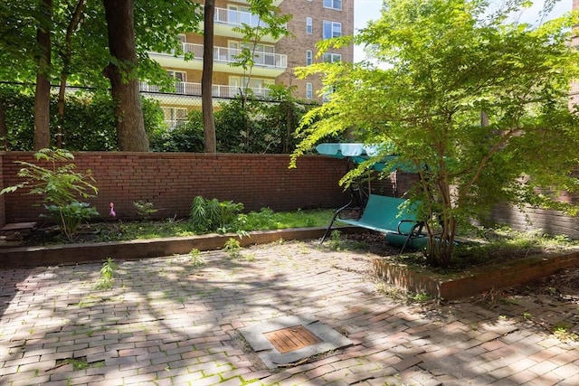 120 Charles St, Boston, MA 02114 - wooden deck with a fenced backyard and a patio