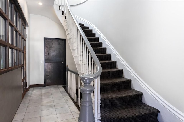 120 Charles St, Boston, MA 02114 - staircase with tile patterned floors, baseboards, and recessed lighting