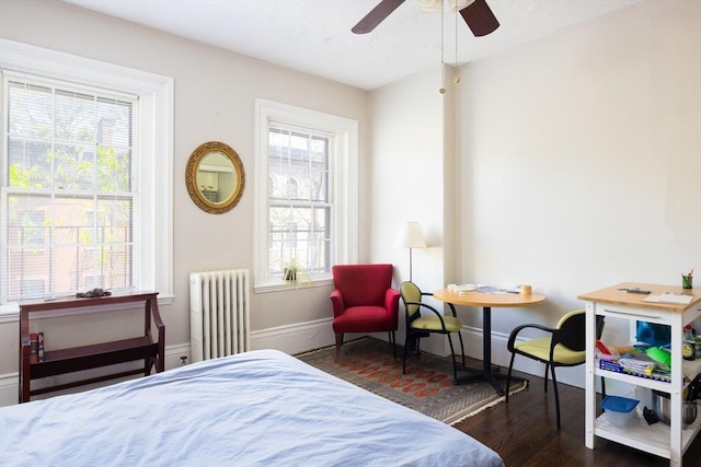 120 Charles St, Boston, MA 02114 - bedroom featuring radiator heating unit, wood finished floors, baseboards, and a ceiling fan