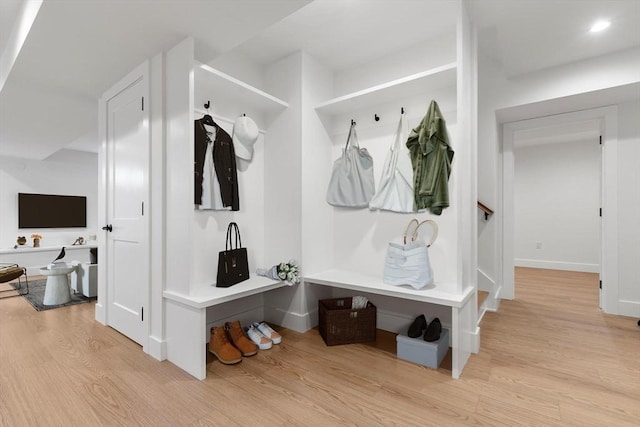 mudroom with recessed lighting, baseboards, and light wood-style flooring