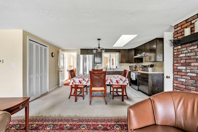 25 Pheasant Cove Cir, Yarmouth, MA 02675 - dining area with a skylight, a textured ceiling, and light colored carpet