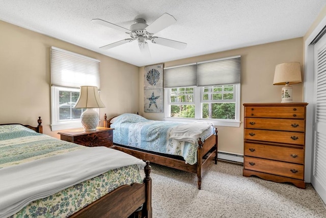 25 Pheasant Cove Cir, Yarmouth, MA 02675 - bedroom with a baseboard radiator, a textured ceiling, ceiling fan, and a closet