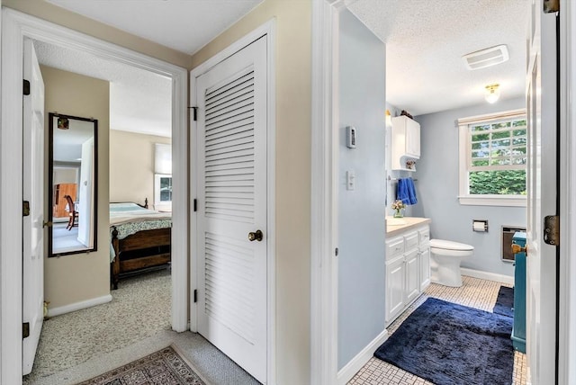 25 Pheasant Cove Cir, Yarmouth, MA 02675 - bathroom with vanity and a textured ceiling