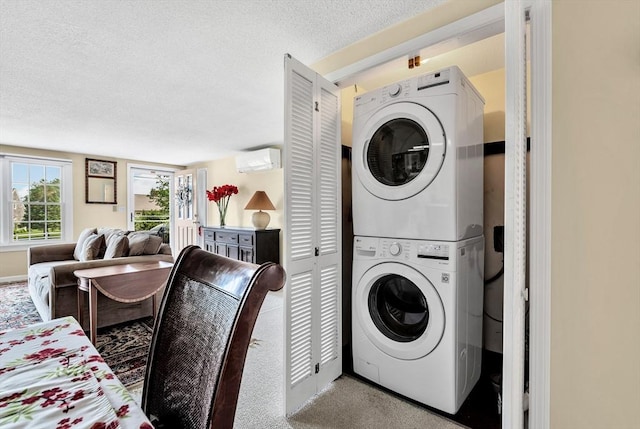 25 Pheasant Cove Cir, Yarmouth, MA 02675 - washroom with stacked washer and clothes dryer, a textured ceiling, and carpet