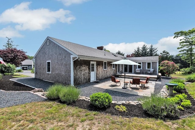 25 Pheasant Cove Cir, Yarmouth, MA 02675 - back of property with a patio and a chimney