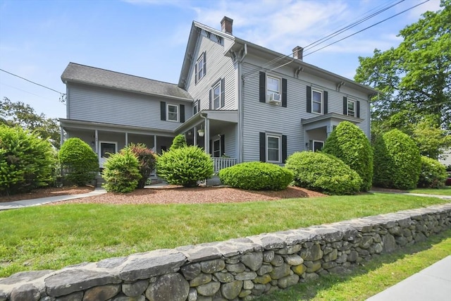 192 Pleasant St Unit 3, Leominster, MA 01453 - view of front facade featuring a chimney and a front yard