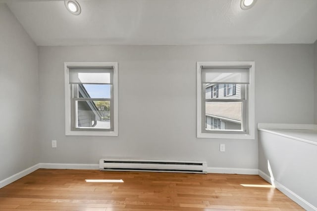 192 Pleasant St Unit 3, Leominster, MA 01453 - empty room with baseboard heating, light wood-type flooring, and baseboards