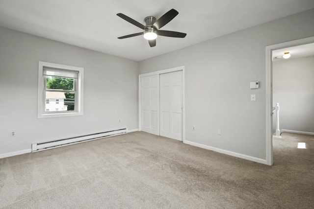 192 Pleasant St Unit 3, Leominster, MA 01453 - unfurnished bedroom featuring a baseboard heating unit, carpet flooring, a closet, and baseboards