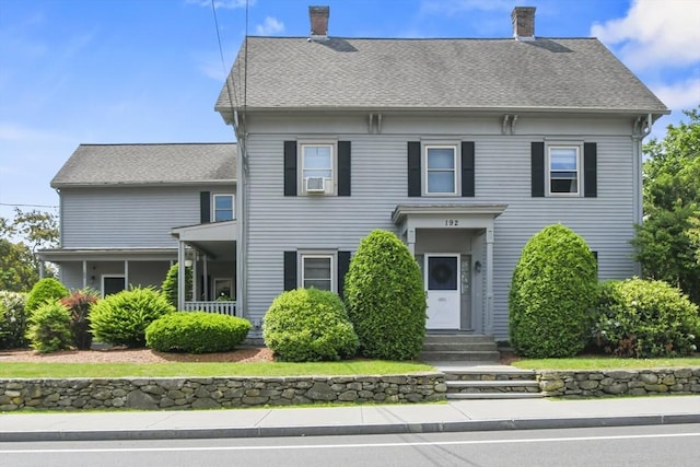 192 Pleasant St Unit 3, Leominster, MA 01453 - view of front of house featuring entry steps, a chimney, cooling unit, and roof with shingles