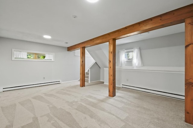 192 Pleasant St Unit 3, Leominster, MA 01453 - basement with a baseboard heating unit, a baseboard radiator, and carpet flooring