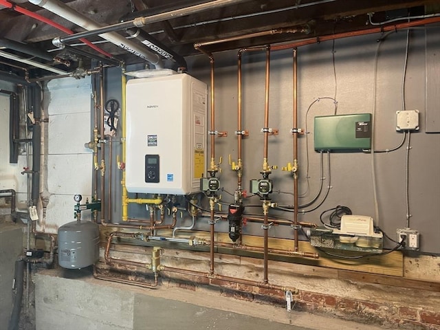 utility room featuring tankless water heater