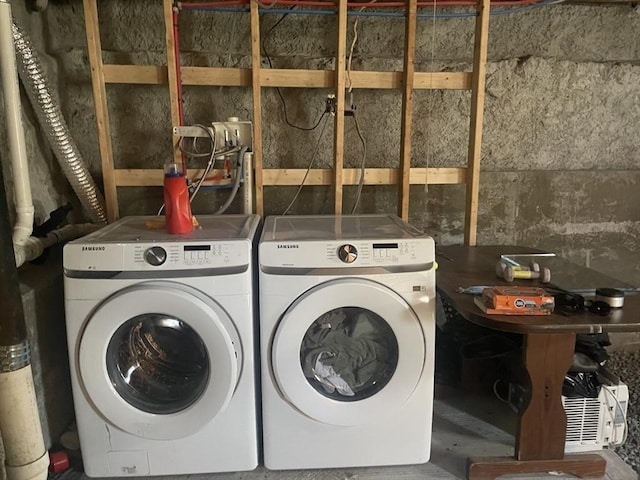 washroom with separate washer and dryer and laundry area