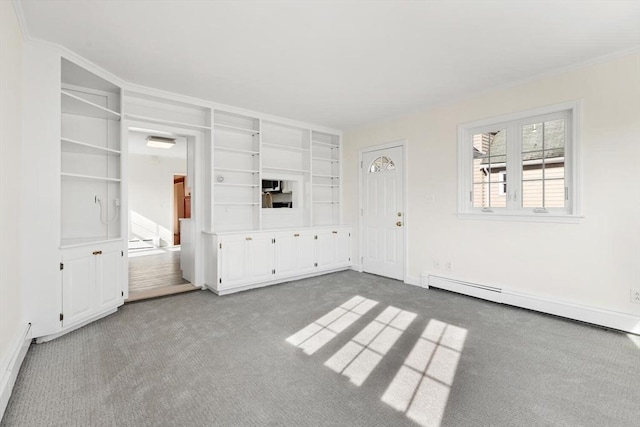 unfurnished living room featuring baseboard heating, ornamental molding, and light carpet